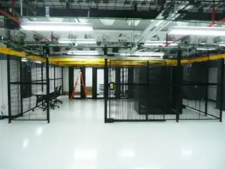 server storage room with wire partition enclosure divider for network servers